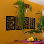 Kit com 4 quadros vazados de folhagem em MDF preto 60x29,5cm. Design moderno, corte a laser e fácil instalação sem furar a parede. Ideal para salas e quartos.