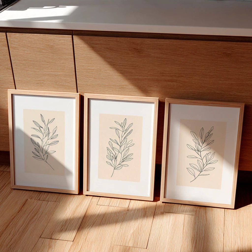 Kit 3 Quadros Douceur com moldura em madeira imunizada e impressão HD. Arte botânica clean e sofisticada para salas, quartos e home office.