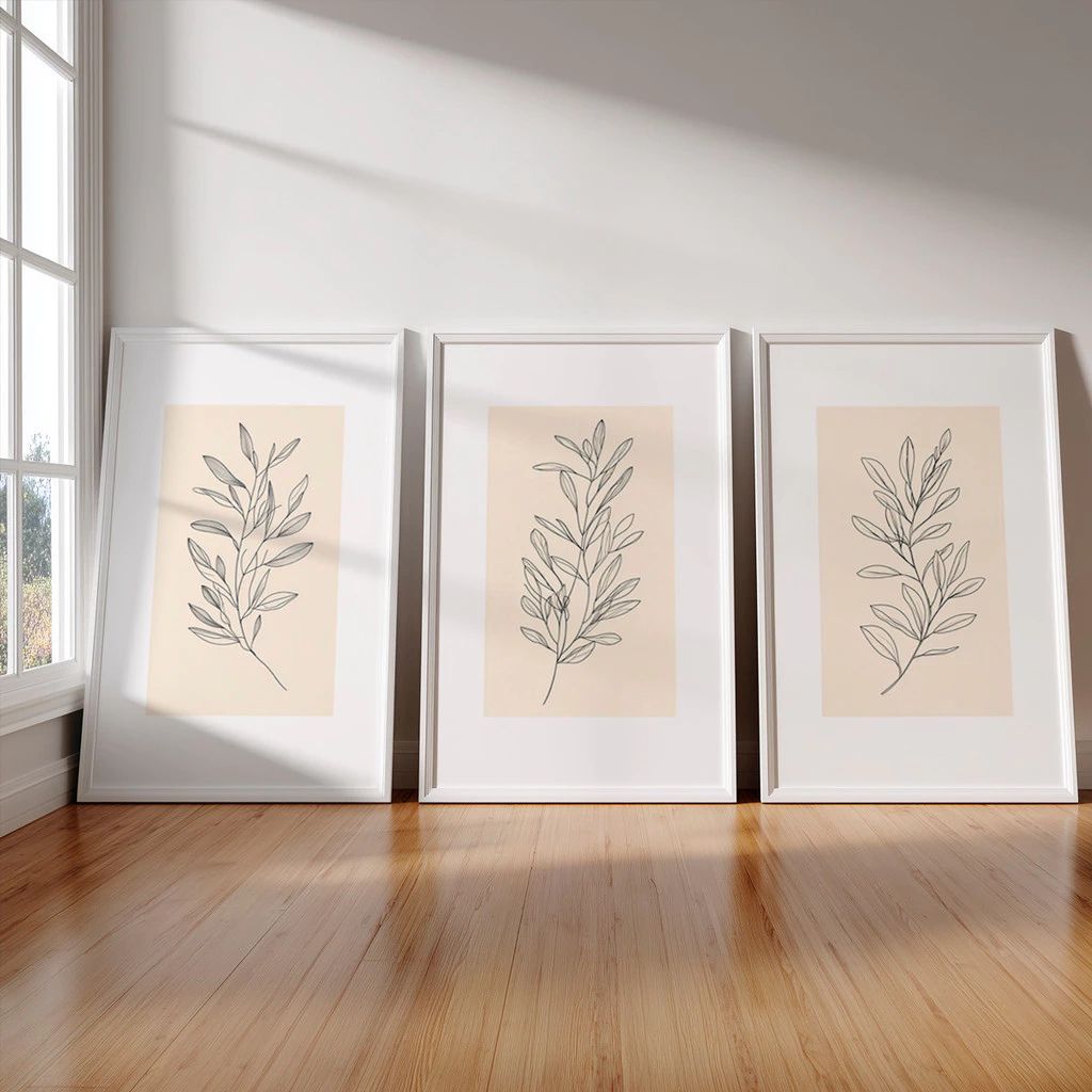 Kit 3 Quadros Douceur com moldura em madeira imunizada e impressão HD. Arte botânica clean e sofisticada para salas, quartos e home office.