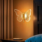 Luminária de parede borboleta com LED integrado e 3 tons de luz (Frio, Neutro e Quente). Design luxuoso em dourado e cristal, bivolt e fácil de instalar. Confira.